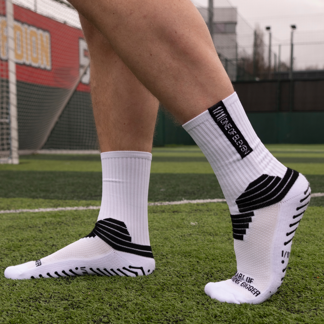 One of Eleven grip socks worn on a football pitch