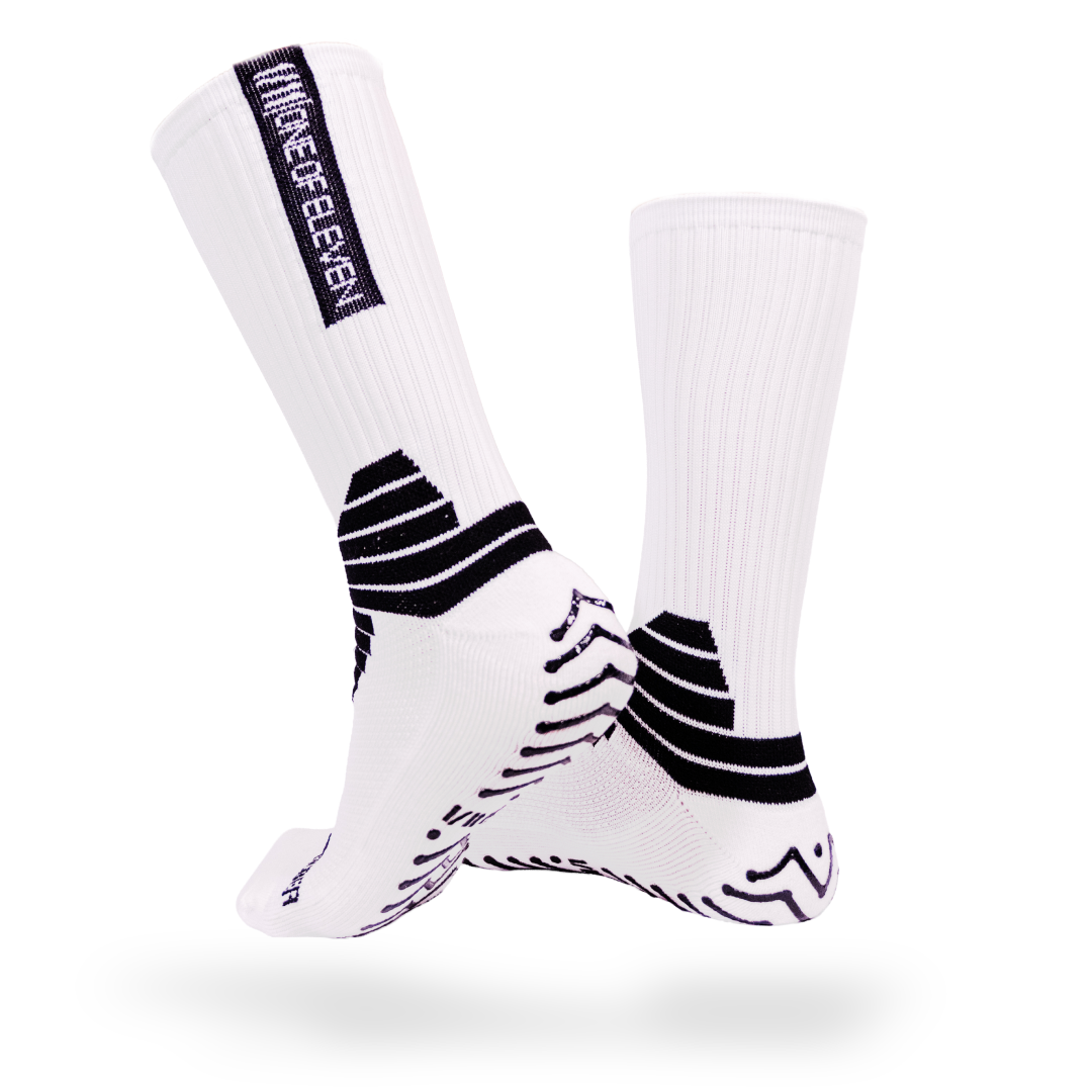 White One of Eleven grip socks with black grip pattern and branding